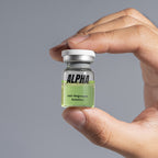 AlphaInfuse Hair Regrowth Serum bottle held in hand